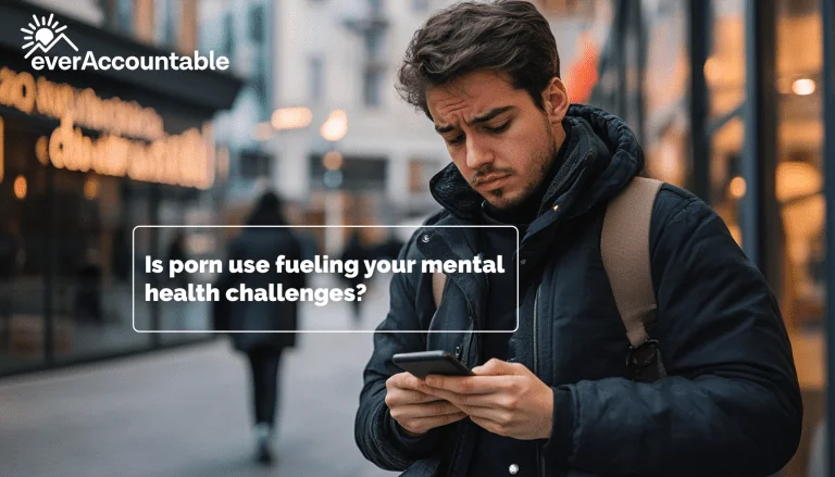 Young man scrolling phone on a street corner How much porn is an addiction - how porn affects mental health